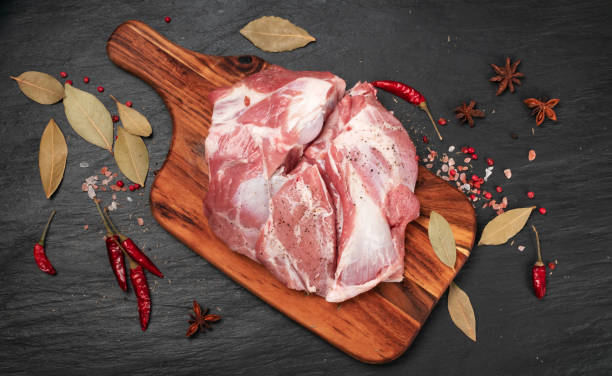 istock Fresh raw beef steak on black stone background 1275809037