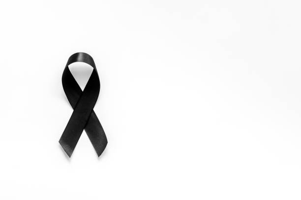 istock Black ribbon as mourning symbol top view 1275810892