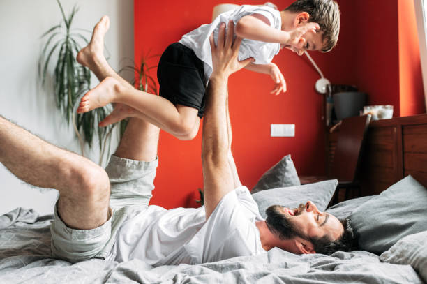 istock Father and little son have fun at home 1275811134