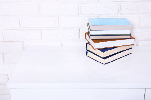 istock Books on the table in a class. Interior design. Copy space and selective focus 1275814275