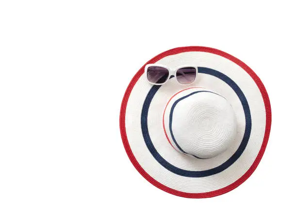 Photo of Summer accessories. Beach hat and sunglasses, top view isolated on white. Mock up and copy space. Top view