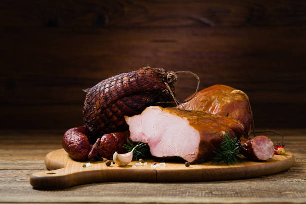 istock Smoked pork on wooden board. 1275820285