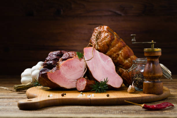 istock Smoked pork on wooden board. 1275820828