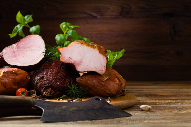 istock Smoked pork on wooden board. 1275821070