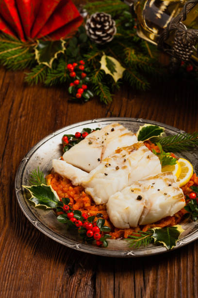 istock Christmas fish. Roasted cod pieces, served in vegetable sauce. 1275821939