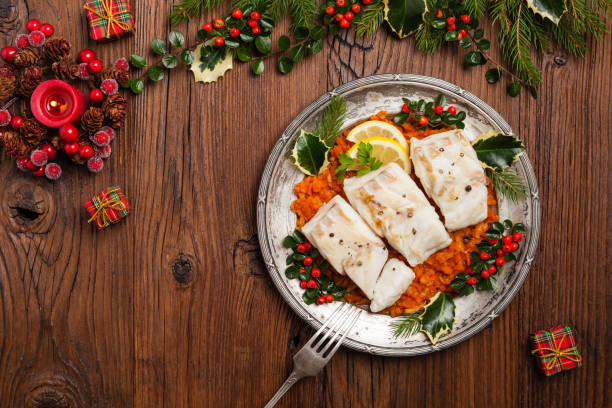 istock Christmas fish. Roasted cod pieces, served in vegetable sauce. 1275822443