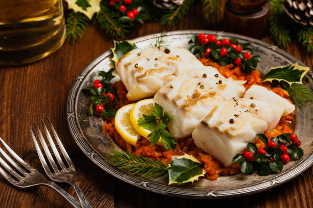 istock Christmas fish. Roasted cod pieces, served in vegetable sauce. 1275822459