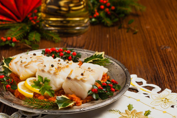 istock Christmas fish. Roasted cod pieces, served in vegetable sauce. 1275822495