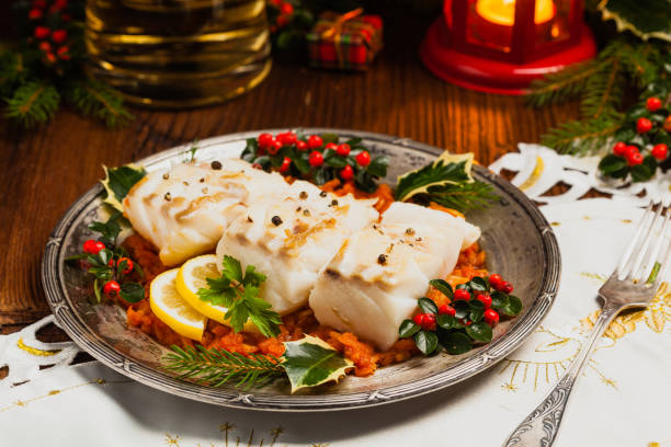istock Christmas fish. Roasted cod pieces, served in vegetable sauce. 1275822559