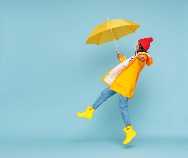istock Ethnic female having fun on rainy day 1275822643