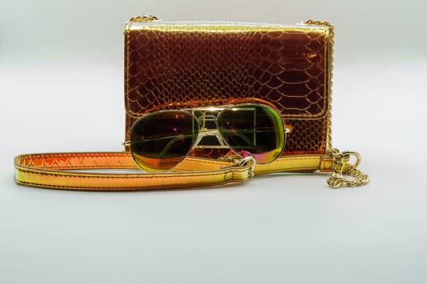 istock Clutch handbag and aviator sunglasses 1275823807