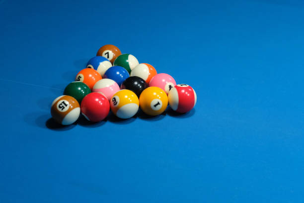 istock group of colorful billiards in triangle on blue pool table. 1275824938