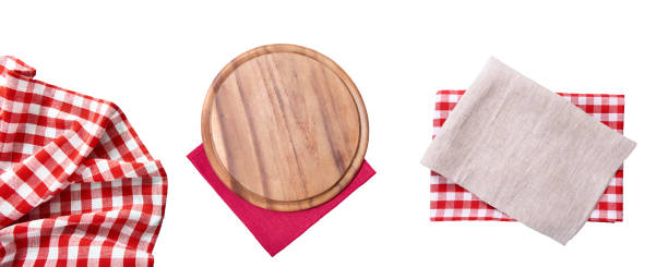 istock Pizza cutting board. Empty tablecloth set and wood plate isolated on white background. Selective focus. Place for food. Top view. Mockup and template copy space. 1275824940