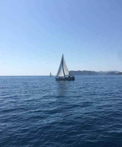 istock Sailing boat in the open sea 1275825184