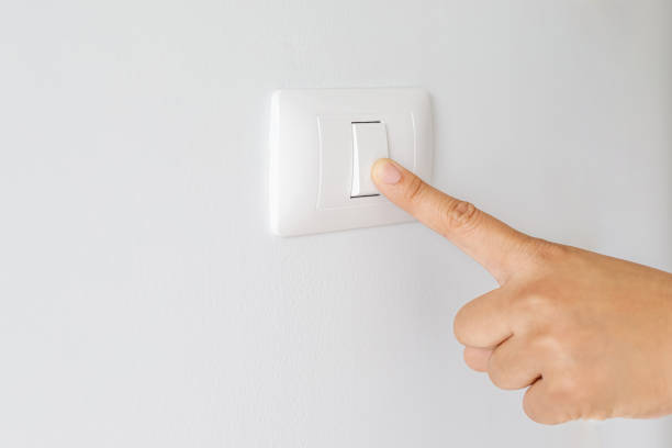 istock Turn on-off the light switch to save electricity. 1275826537