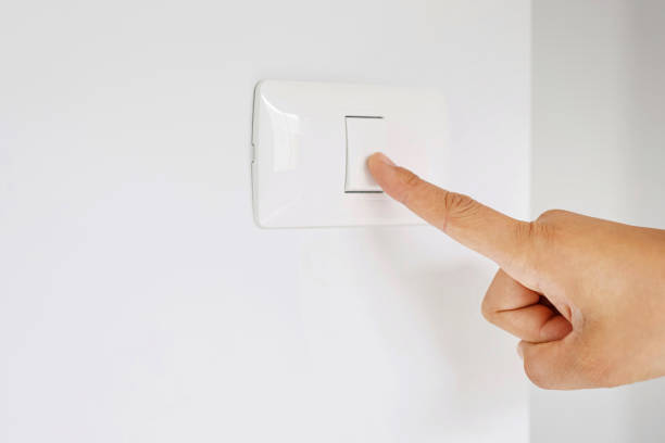 istock Turn on-off the light switch to save electricity. 1275826555