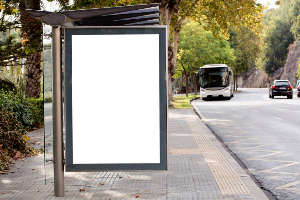 istock Blank advertising billboard mockup and template or light billboards with copy space for text or message and media content, Blank shadow billboards with display on city wall background with bus 1275828397