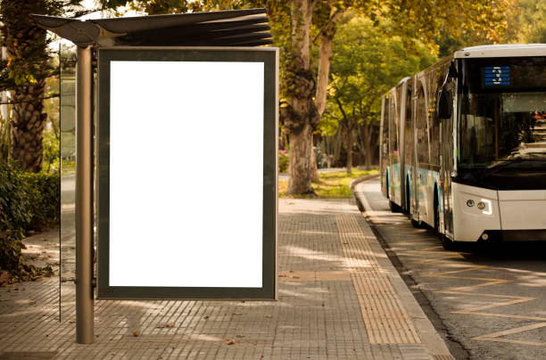 istock Blank advertising billboard mockup and template or light billboards with copy space for text or message and media content, Blank shadow billboards with display on city wall background with bus 1275828983