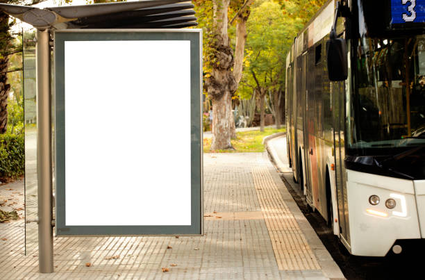 istock Blank advertising billboard mockup and template or light billboards with copy space for text or message and media content, Blank shadow billboards with display on city wall background with bus 1275829005