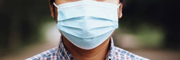 istock People in protective medical face masks. Coronavirus COVID-19 1275829109