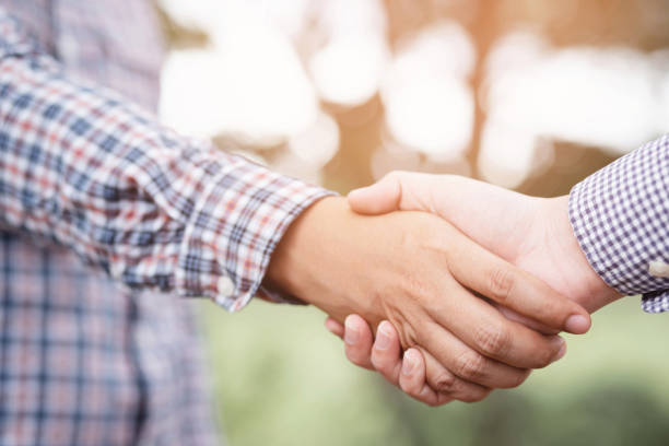 istock Handshake Gesturing People Connection Deal Concept 1275829146
