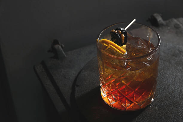 istock Male red alcoholic cocktail with walnut and prunes 1275830713