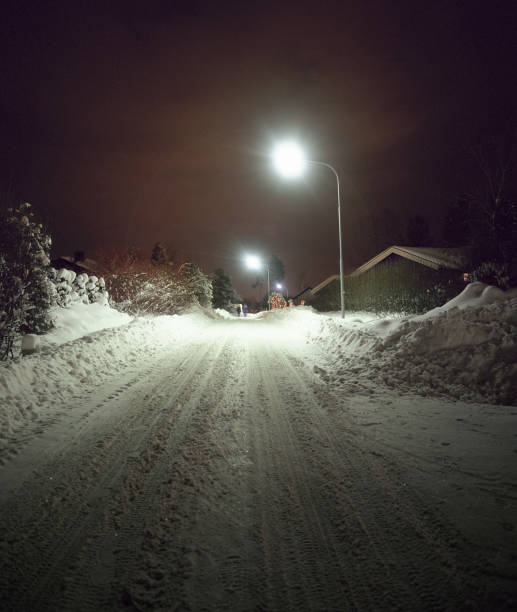 istock Snow-covered Street at Night 1275831917