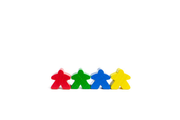 istock Work in a team concept. Four best friends. Colourful game figures are isolated on a white background. 1275833459