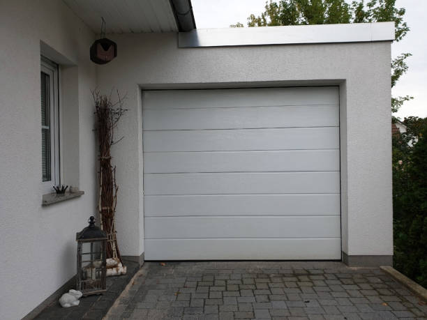 istock Automatic garage door in front of the house 1275834804