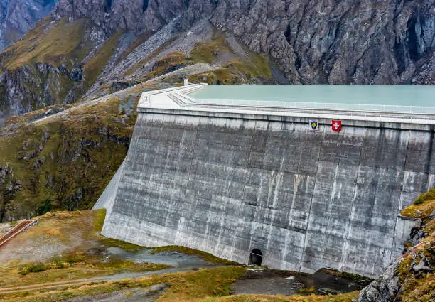 Photo of Grande Dixence Dam in Swiss Alps. The tallest gravity dam.