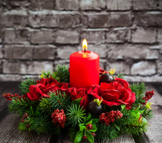 istock Christmas table decoration with burning red candle 1275836933