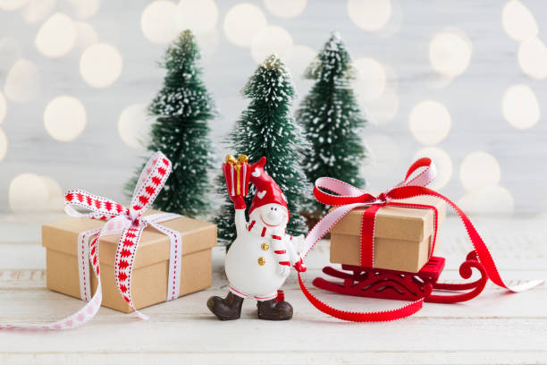 istock Snowman,gift boxes and decorative Christmas trees 1275836958