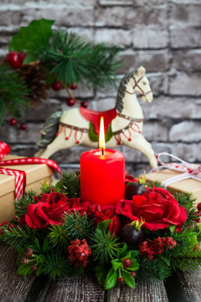 istock Christmas table decoration with burning red candle 1275837467