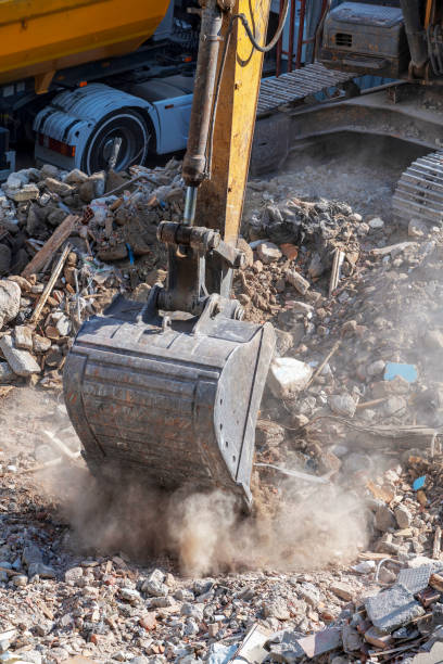 istock Yellow excavator is working on the construction site 1275838104