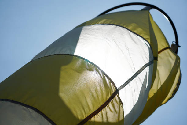 istock Simple concept of a wind sock on a blue background. 1275838541