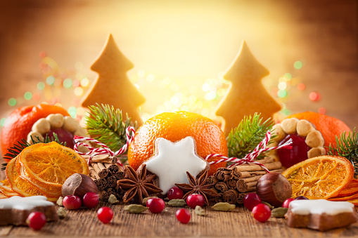 Christmas decoration with mandarins,cookies,berries and spices