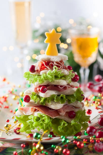 istock Christmas tree from toasted bread, lettuce, ham and cheese 1275839446