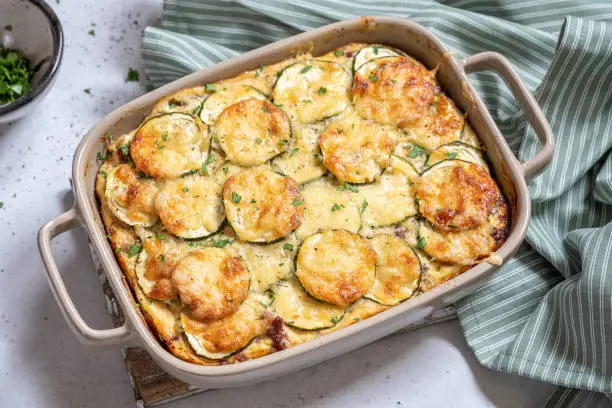 casserole with cheese and zucchini in baking dish