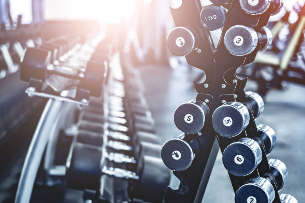 istock rows with a set of dumbbells 1275840945