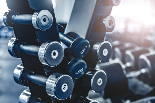 istock rows with a set of dumbbells 1275840946
