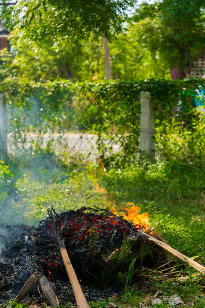 istock A large pile of burning branches and leaves with smokes 1275843349