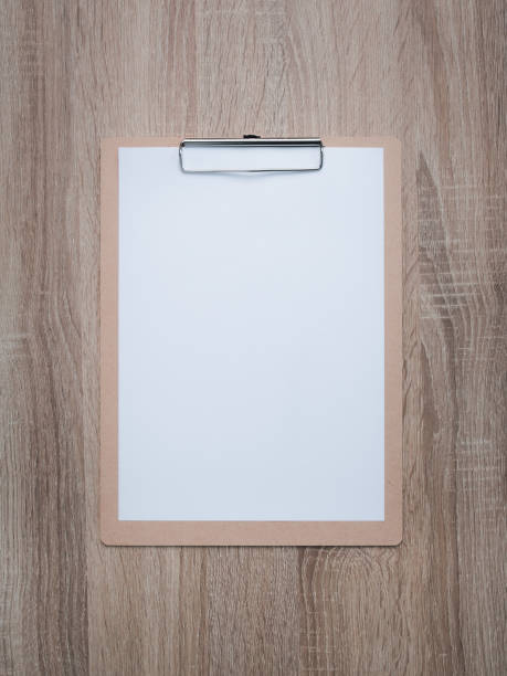 istock Blank clipboard on wooden desk background. 1275844143