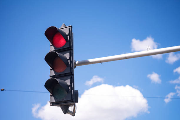 Low Angle View Of Traffic Stoplight With Red Signal Light stock photo