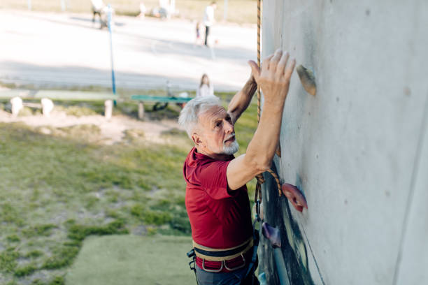 istock Portrait of a senior man practicing rock climbing 1275848802