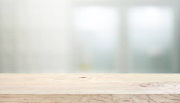 istock Wood table top on white wall glass  background. 1275849897