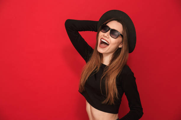 istock Laughing young woman standing isolated 1275851137