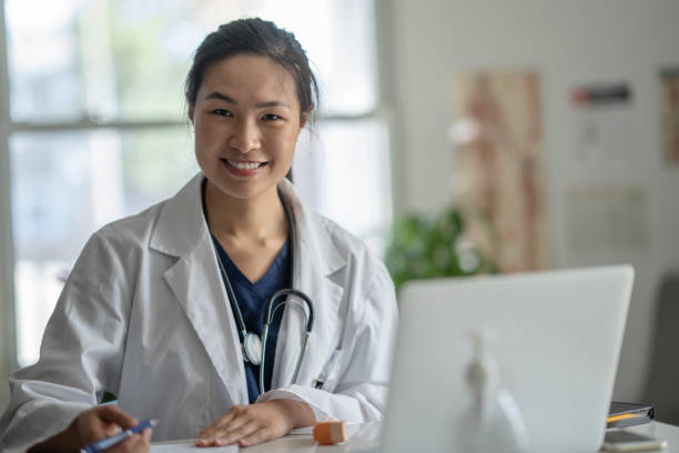 istock Asian female doctor doing a remote medical appointment 1275851148