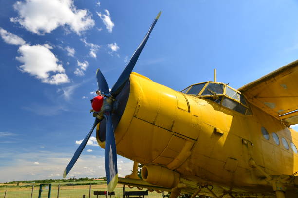 istock Close-up view of an old yellow plane. 1275851397