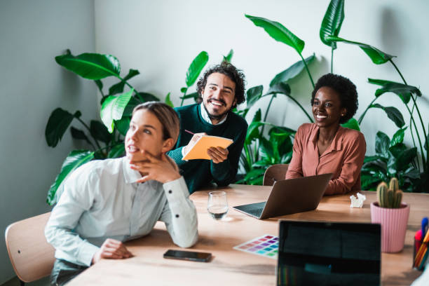 Creative business team listening at a meeting.