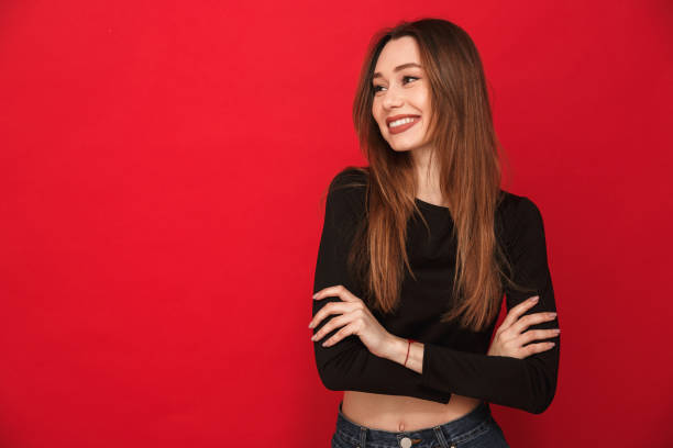 istock Happy young woman standing isolated 1275851593
